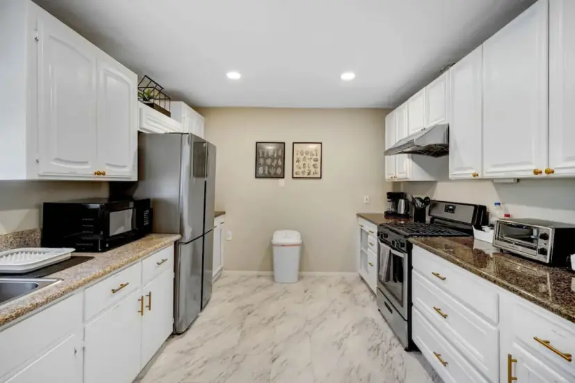 White kitchen with granite counters
