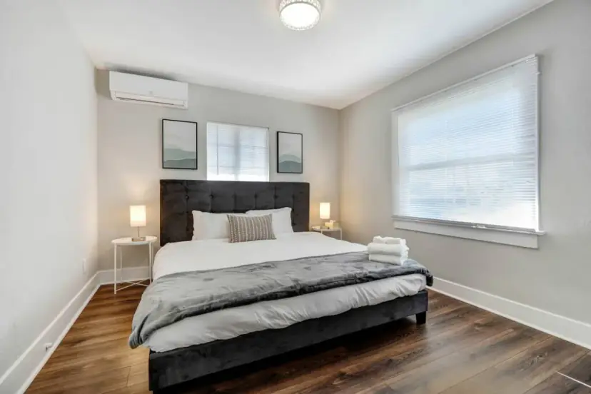Bedroom with a king bed and an upholstered headboard