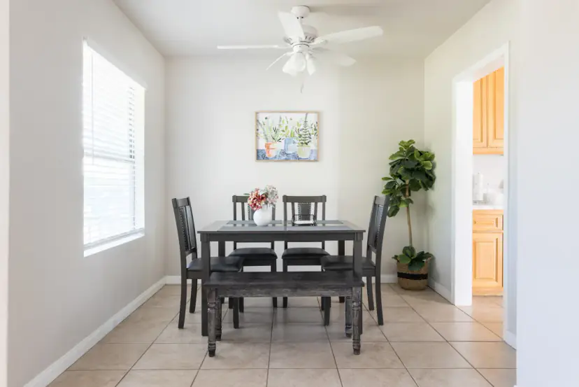 Dining nook with a bench and a ceiling fan