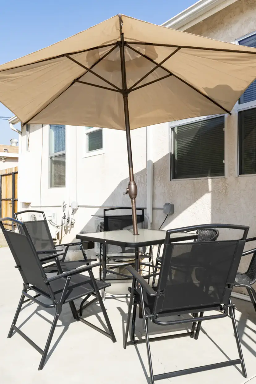 Patio dining set under an umbrella