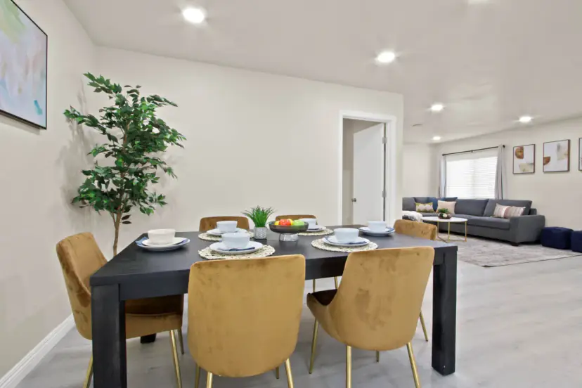 Dining table open to the living room sectional