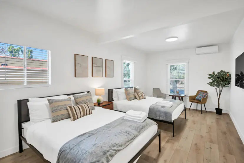 Two queen beds with a sitting area