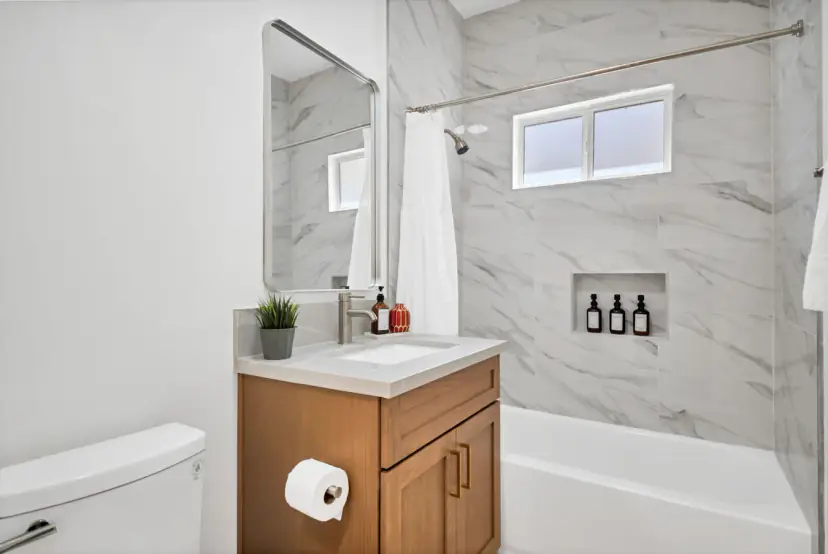 Bathroom with a marble-look tub surround