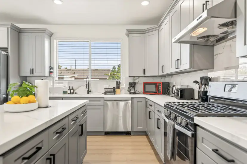 Kitchen with a dishwasher and a red microwave