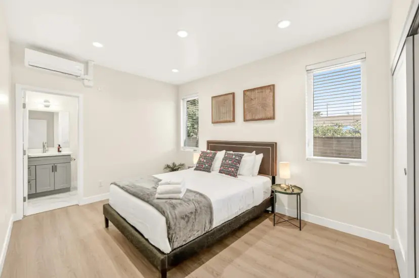 Bedroom with a queen bed and an ensuite bathroom