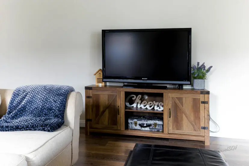 TV on a rustic barn-style media console