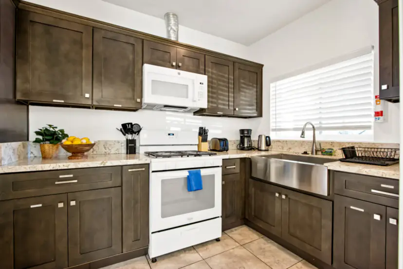 Kitchen with a farmhouse sink and a microwave