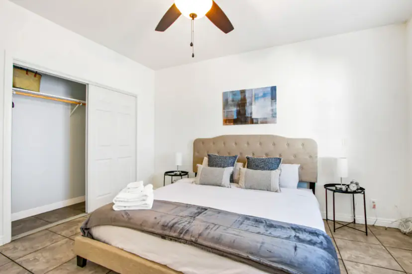 Bedroom with a closet and a king bed