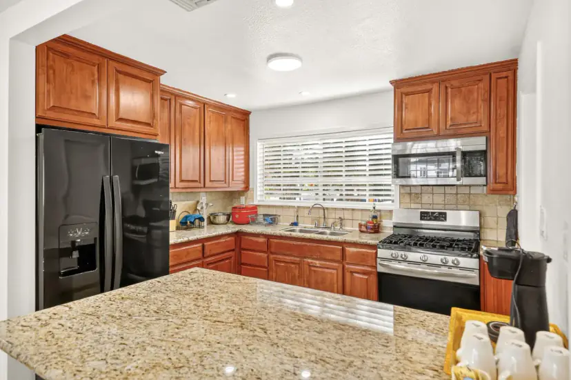 Kitchen with cherry cabinets and a gas range