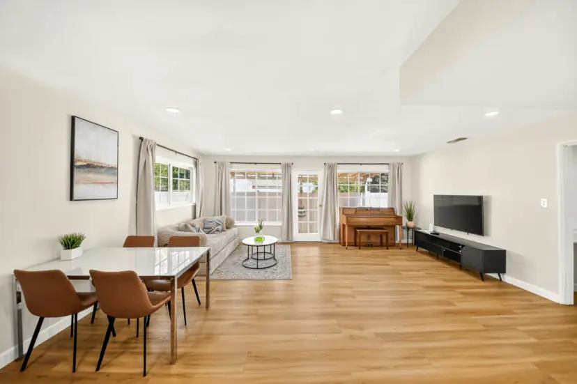 Dining table with tan leather chairs