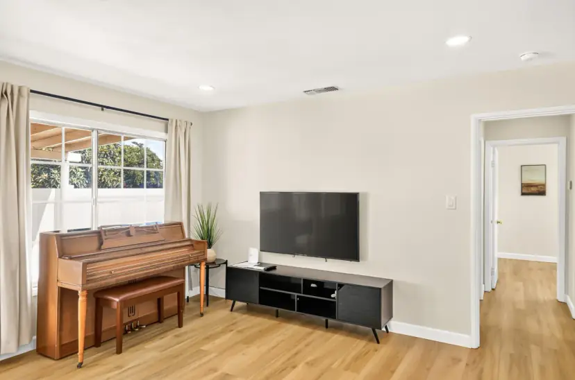 Living room with a TV and the piano
