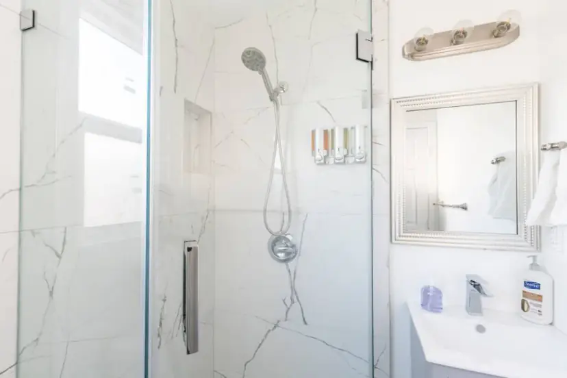 Bathroom with a marble-look glass shower