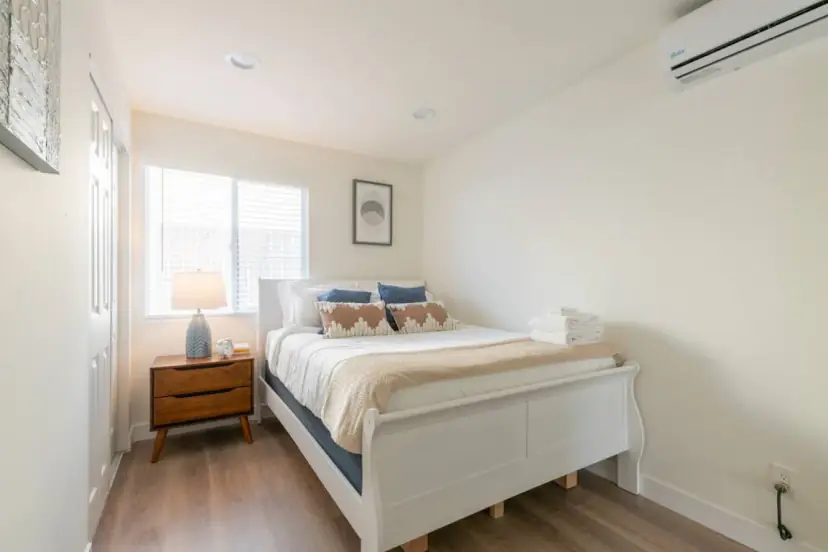 Bedroom with a white sleigh bed