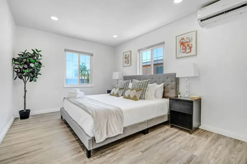 Bedroom with a king bed and an upholstered headboard