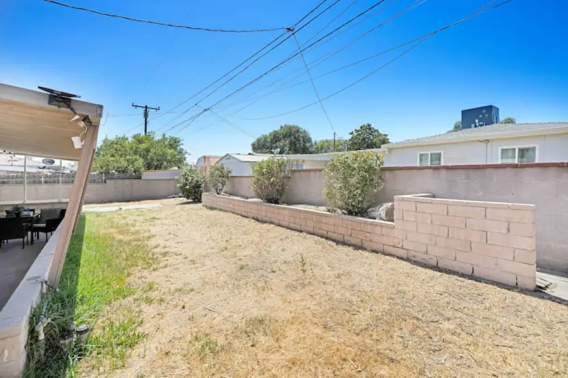 Backyard behind a block wall