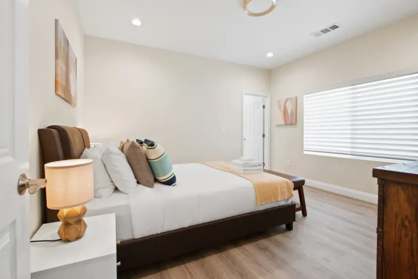 Bedroom with a dark wood bed and a dresser