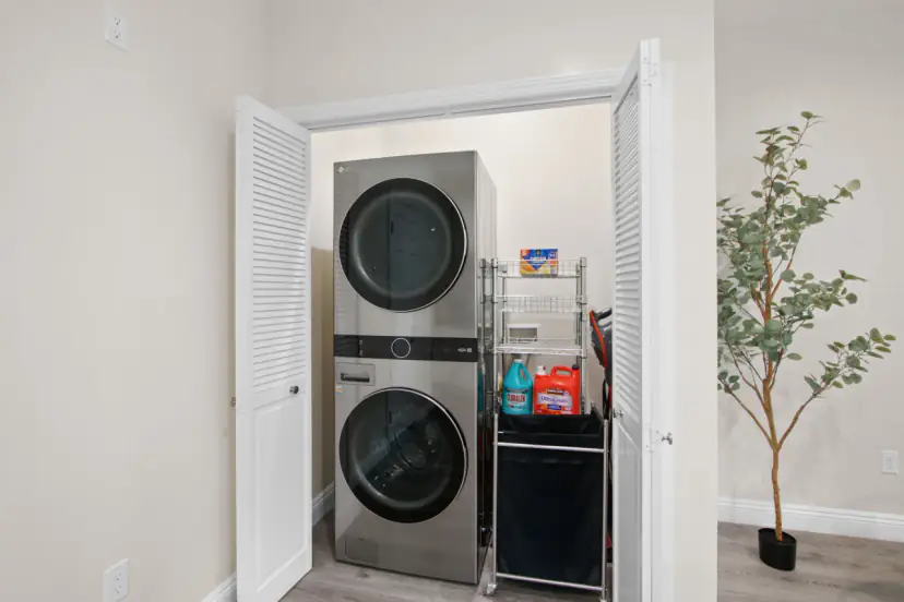 Stacked washer and dryer in a closet