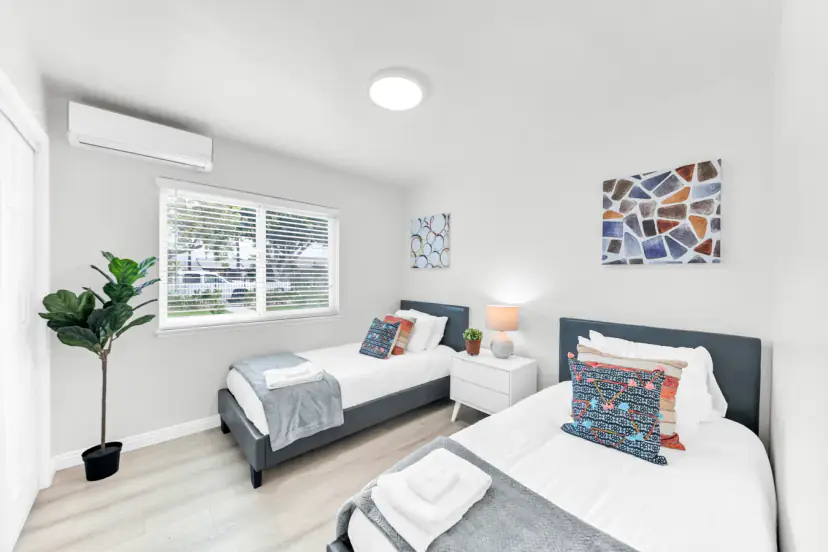 Two twin beds with mosaic art