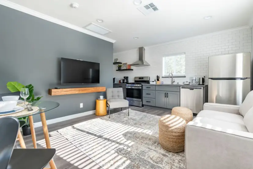 Living area with a sofa and the kitchen beyond