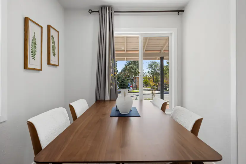 Long dining table by sliding doors