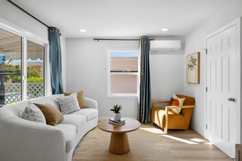 Curved sofa with an amber armchair