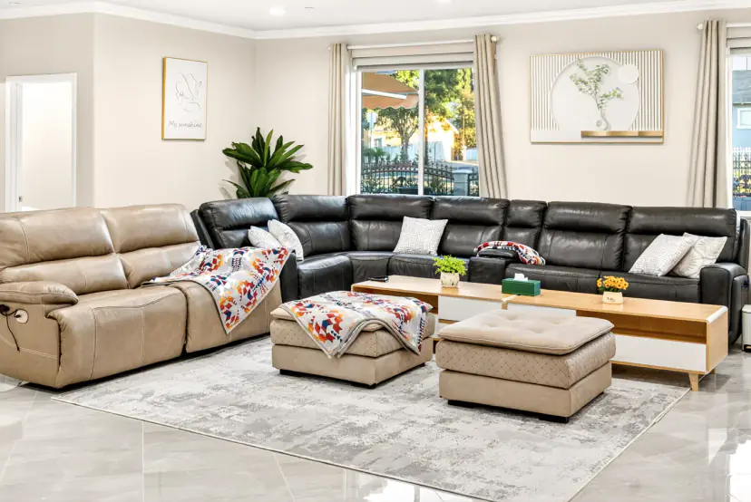 Black leather sectional and tan recliner sofa with ottomans