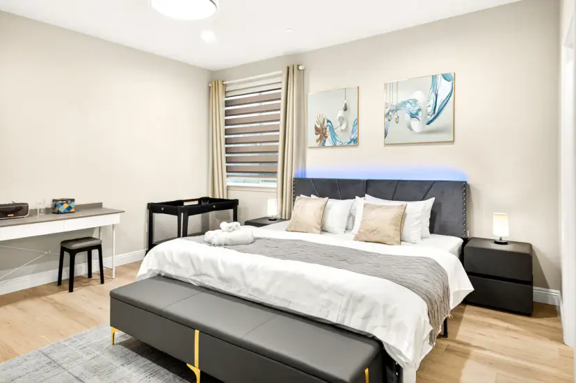 Bed with an LED-lit headboard, bench, desk and crib