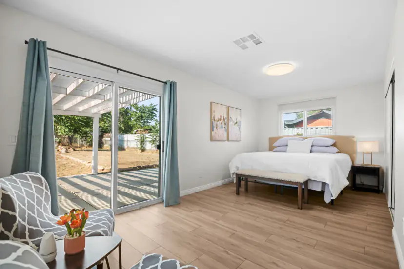 Primary bedroom with sliding doors to the patio