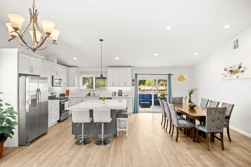 Open kitchen with an island and dining for eight