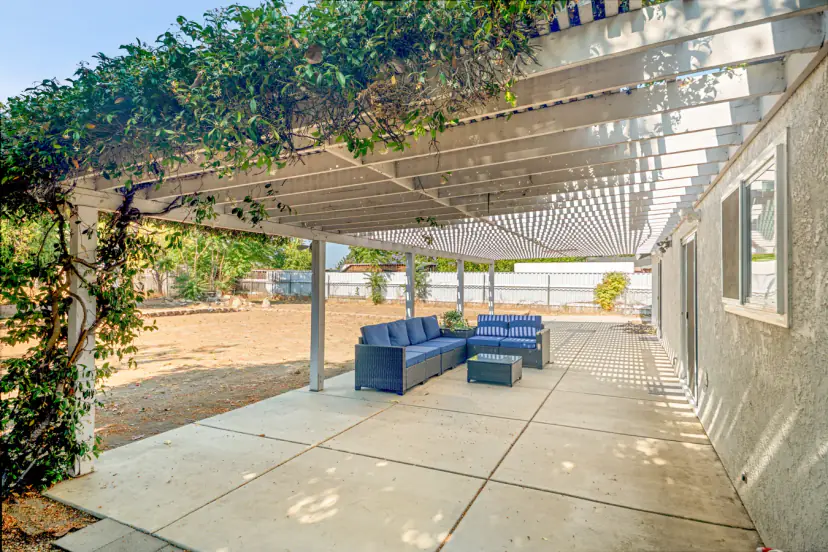 Long pergola patio with outdoor seating