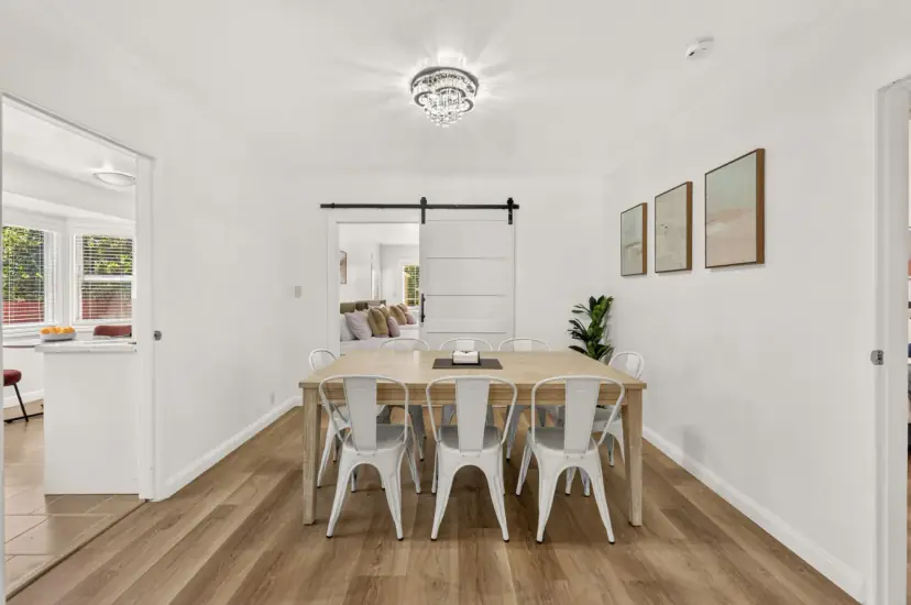 Dining table for eight with white metal chairs