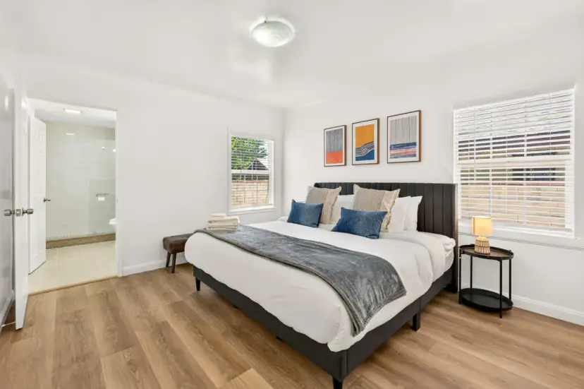 Bedroom with a king bed and navy pillows