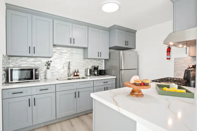 Grey shaker kitchen with a mosaic backsplash