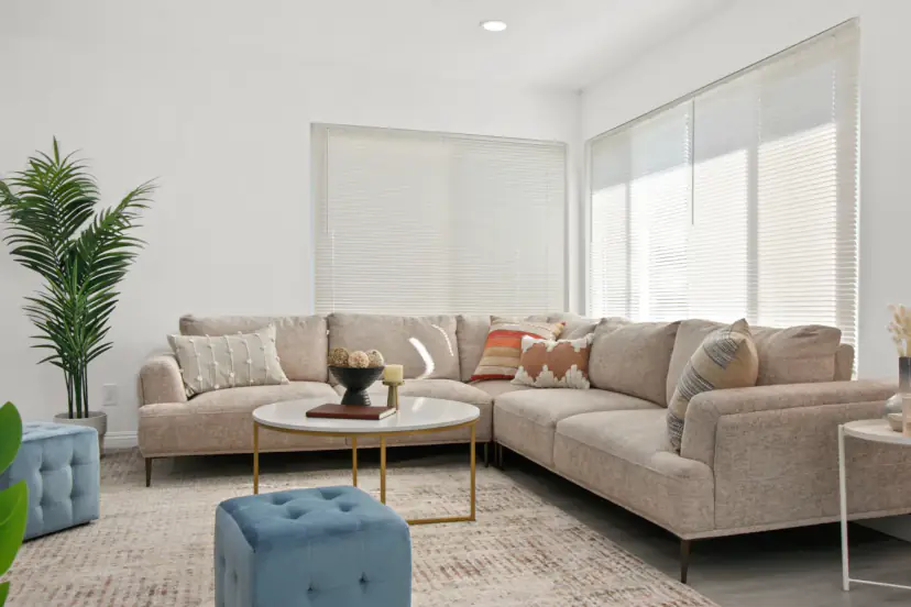 Beige sectional with a round coffee table