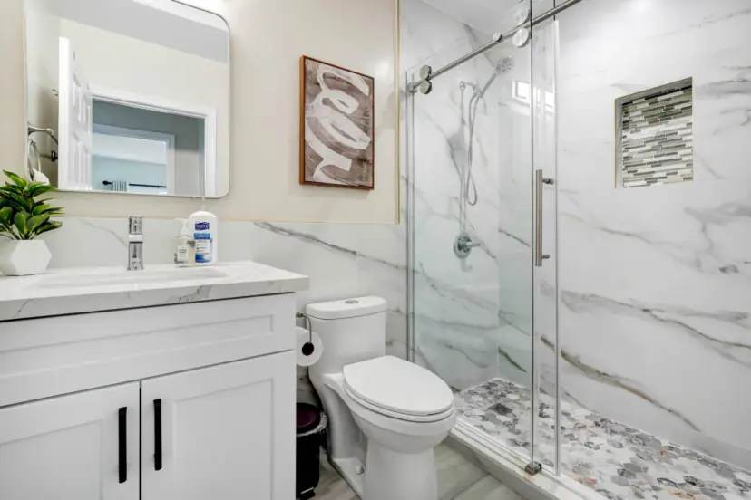 Bathroom with a marble-look glass shower
