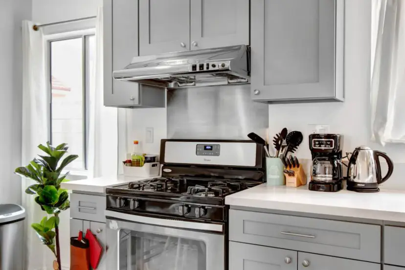 Gas range with a coffee maker and kettle