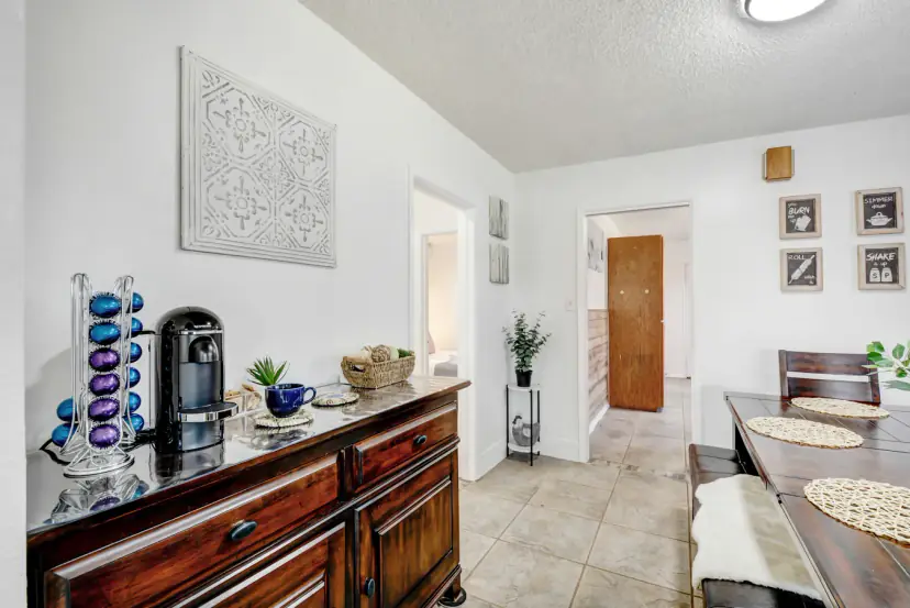 Coffee station on a wood sideboard by the dining table