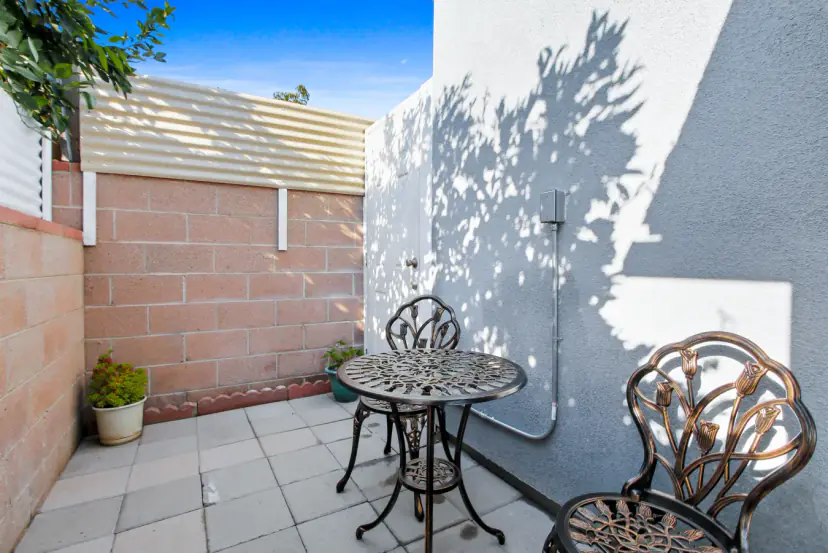 Small patio with a bistro table and chairs