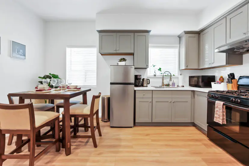 Dining table beside the grey kitchen