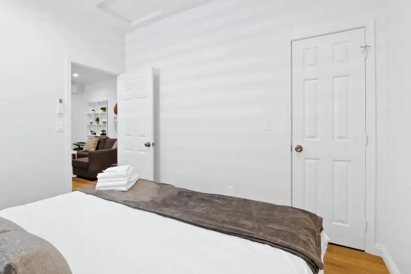 Bedroom with a closet and a view to the living room