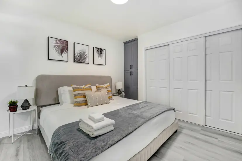 Bedroom with a king bed and a sliding closet