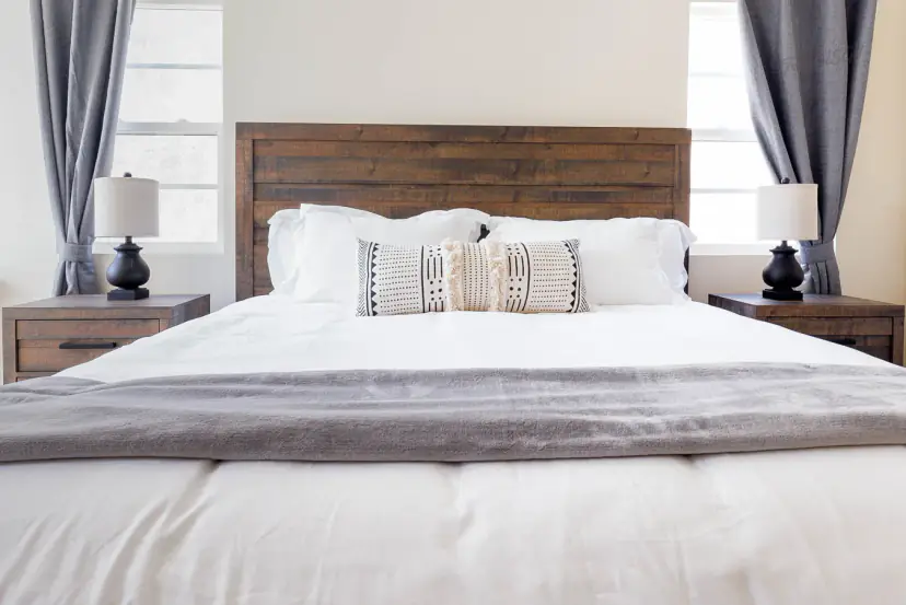 Bed with a rustic plank headboard and nightstands