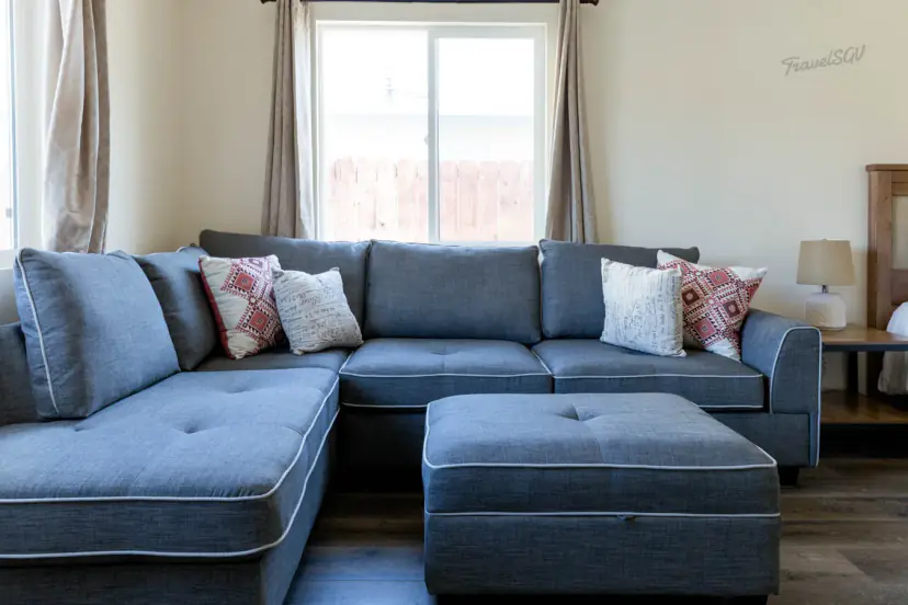 Blue-grey sectional with an ottoman