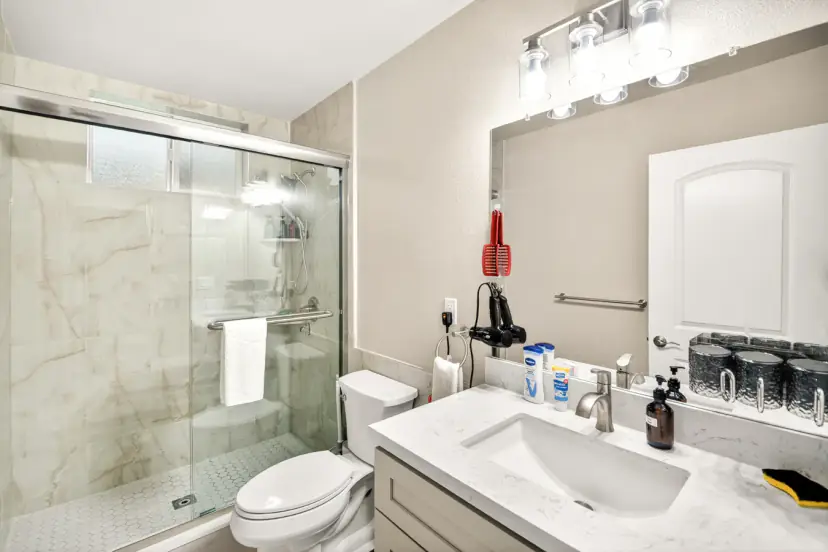 Bathroom with a glass shower and quartz vanity