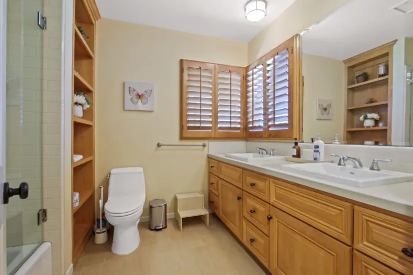 Bathroom with a double vanity and plantation shutters