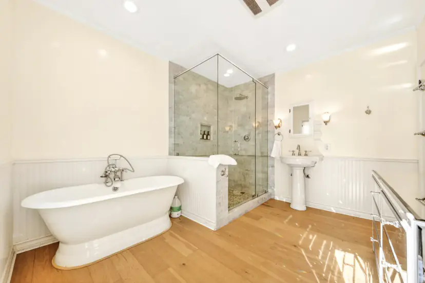 Primary bath with a freestanding tub and a glass walk-in shower