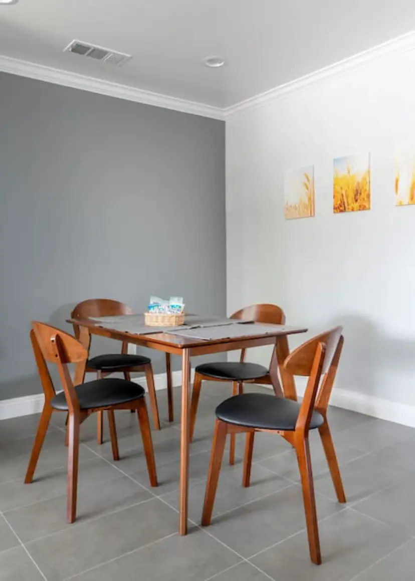 Dining table with four wood chairs
