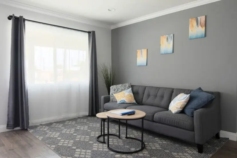 Living room with a grey sofa and nesting tables