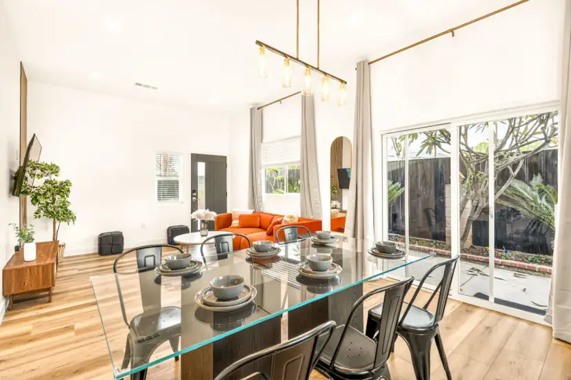 Glass dining table beside sliding doors