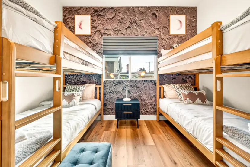 Bunk room with two sets of wooden bunk beds
